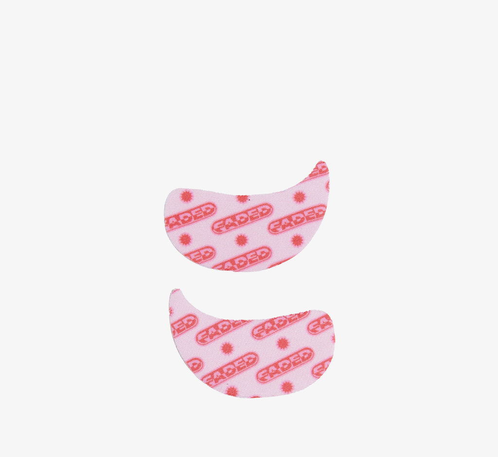 Depuffing eye mask pair from Topicals Faded in the pink branded colorway shown on a white background.